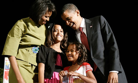Barack and Michelle Obama with daughters Malia (2nd left) and Sasha